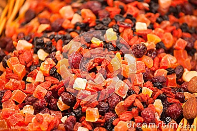 Scattering of different candied fruits on counter