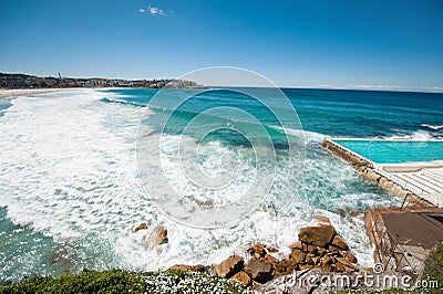 Scenic coastline with blue sky and sun