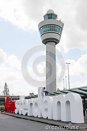 Schiphol airport control tower with I am Amsterdam sign