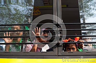 School children going home after classes at primary school by school bus. India