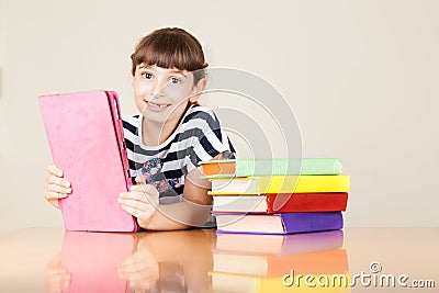 School Girl With Colourful Books And Tablet