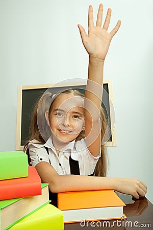 School girl ready to answer for teacher question