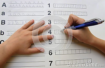 School kids writening alphabet