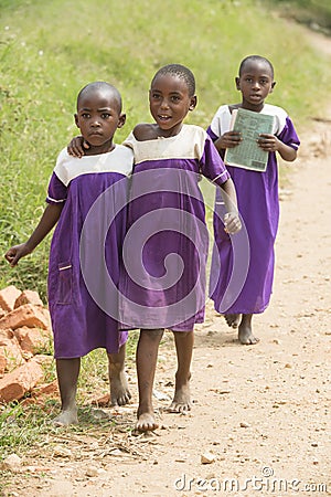 Schoolgirls in Africa barfoot with school uniform