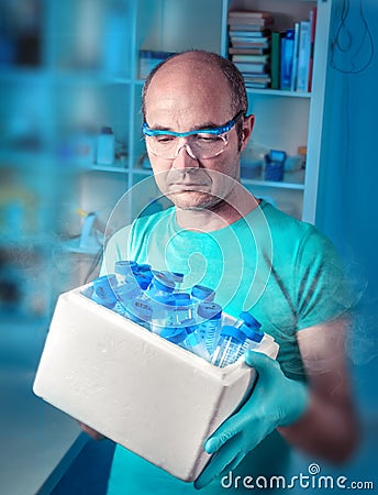 Scientist with box of samples