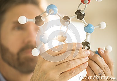 Scientist Examining Molecular Structure