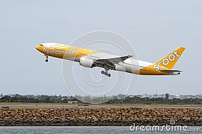 Scoot Airlines Boeing 777 jet taking off.