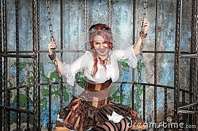 Screaming beautiful steampunk woman in the cage