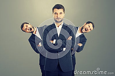 Screaming men behind confident businessman