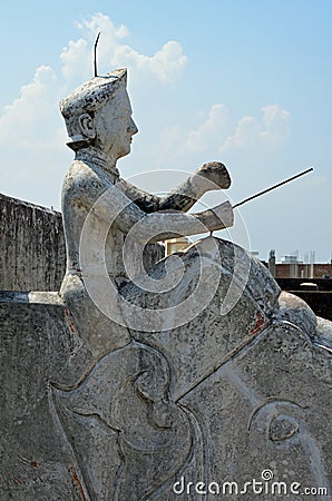 Sculpture of man riding elephant, roof-top, Mandaw