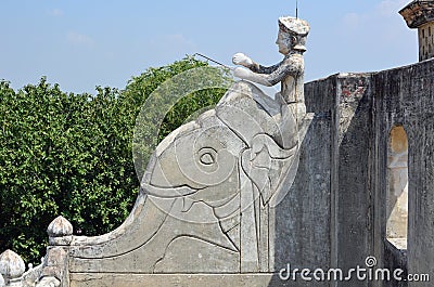 Sculpture of man riding elephant, roof-top, Mandaw