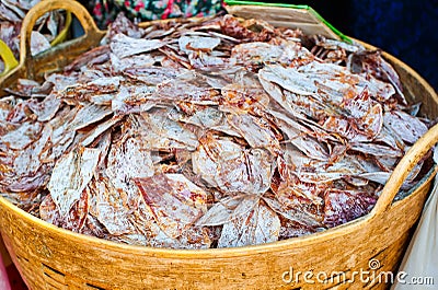 Sea food at market. Dry calamari