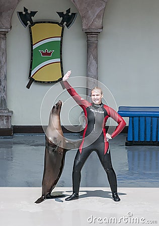 Sea lion and trainer