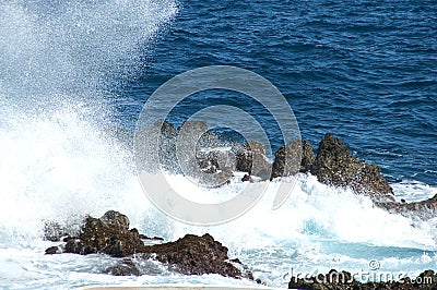 Seascape with hitting rough seas on the rocks