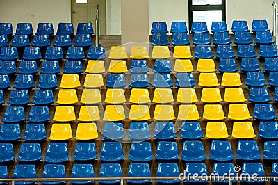 Seats in basketball stadium .