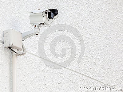 Security camera, CCTV on the white cement wall