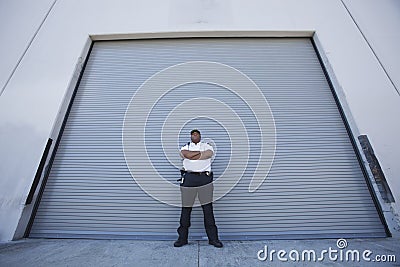 Security Guard Protects Warehouse Entrance