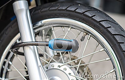 Security lock blocking the motorcycle front wheel