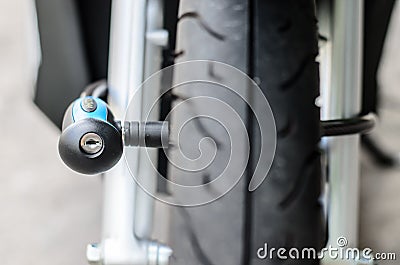 Security lock blocking the motorcycle front wheel