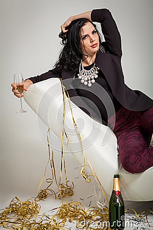 Seductive brunette holding a glass of champagne