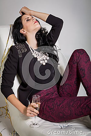 Seductive brunette holding a glass of champagne