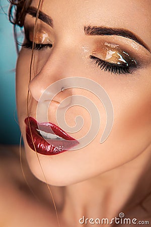 Seductive woman with closed eyes and wet make up