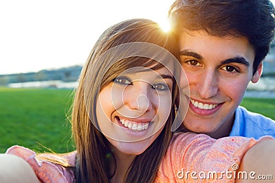 Selfie couple taking photos with a smartphone