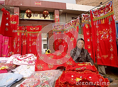 Sell cloth products of the male the shopkeeper