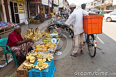 Seller on local market in Sri Lanka - April 2, 2014