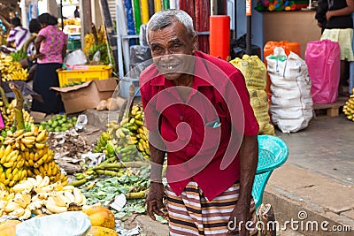 Seller on local market in Sri Lanka - April 2, 2014