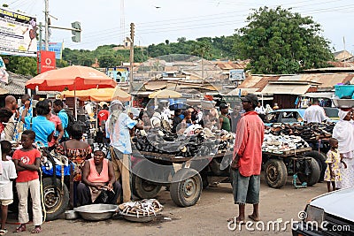 Selling fish and shoes on African street market
