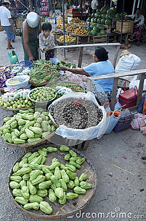 Selling off assorted fruits and vegetables busy market