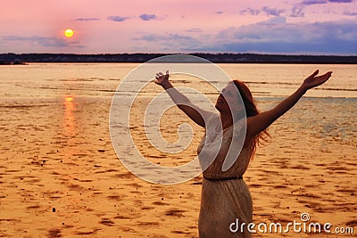 Semi Silhouette of Woman Raising Hands at Ocean