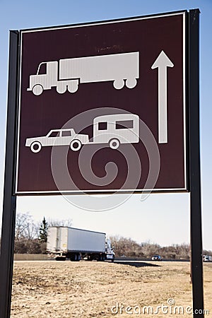 Semi Truck seen under the sign