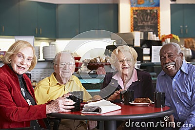 Senior adults having morning tea together