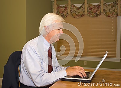 Senior Businessman on Laptop