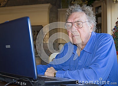 Senior citizen on computer