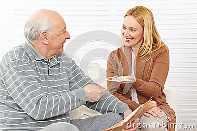 Senior citizen and woman eating