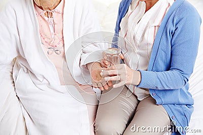 Senior citizen woman getting pill