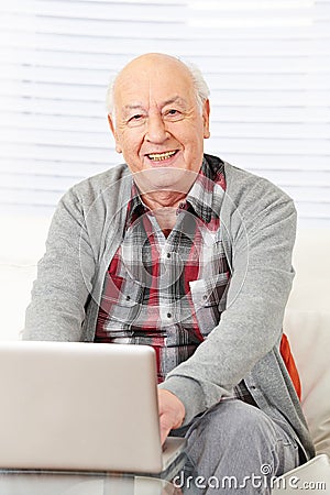 Senior citizen working with laptop