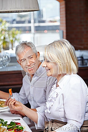 Senior citizens eating in nursing