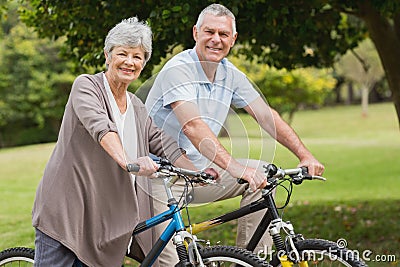 Senior couple on cycle ride in countryside