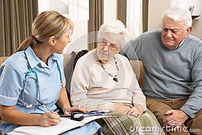 Senior Couple In Discussion With Health Visitor