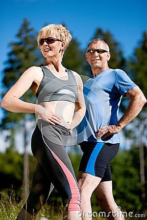 Senior couple doing sport exercising outdoors