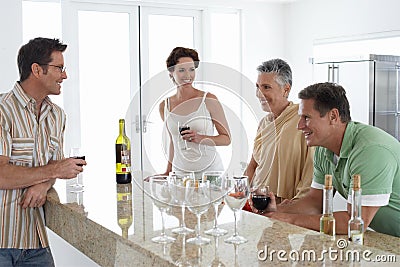 Senior Couple Having Wine With Family