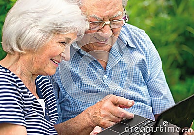 Senior couple with laptop