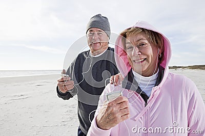 Senior couple listening to music on MP3 player