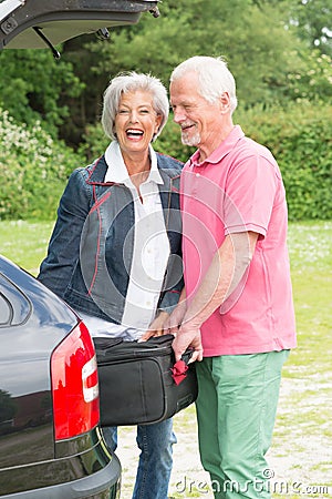 Senior couple with luggage