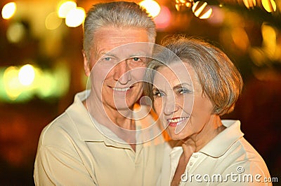 Senior couple on night street