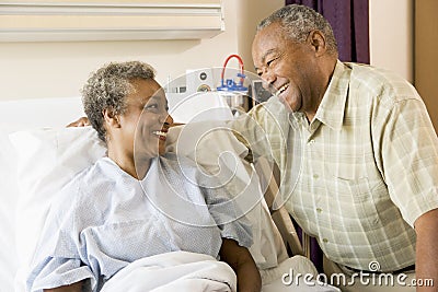 Senior Couple Smiling At Each Other In Hospital